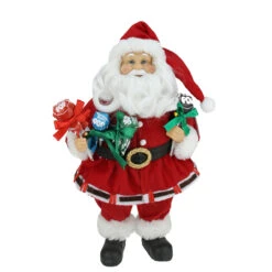 Northlight 12" Red And White Santa Claus Holding Tootsie Pops Christmas Tabletop Decoration