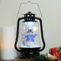 Northlight 13.5" Black Lighted Musical Snowman Snowing Christmas Table Top Lantern -Christmas Decoration Store t4hzbqiun74bhuonrgfihnd3v2xv3yeo 18701.1588411220
